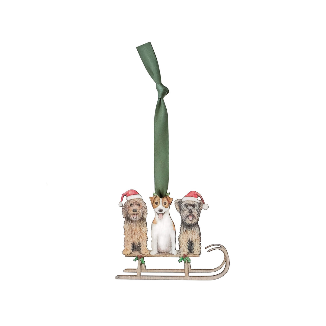 wooden dog christmas tree decoration with green ribbon