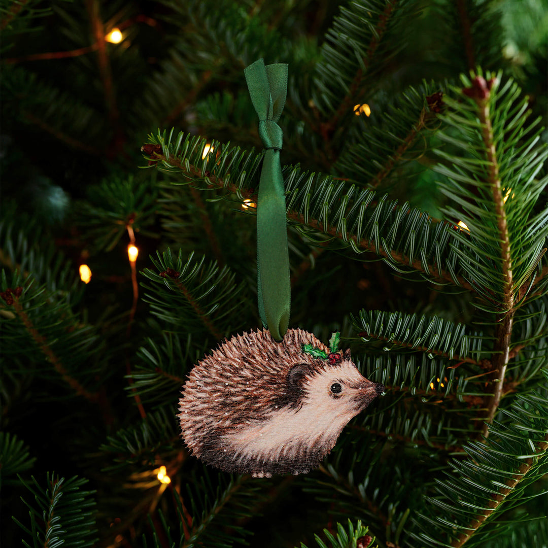 wooden hedgehog christmas tree decoration with green ribbon