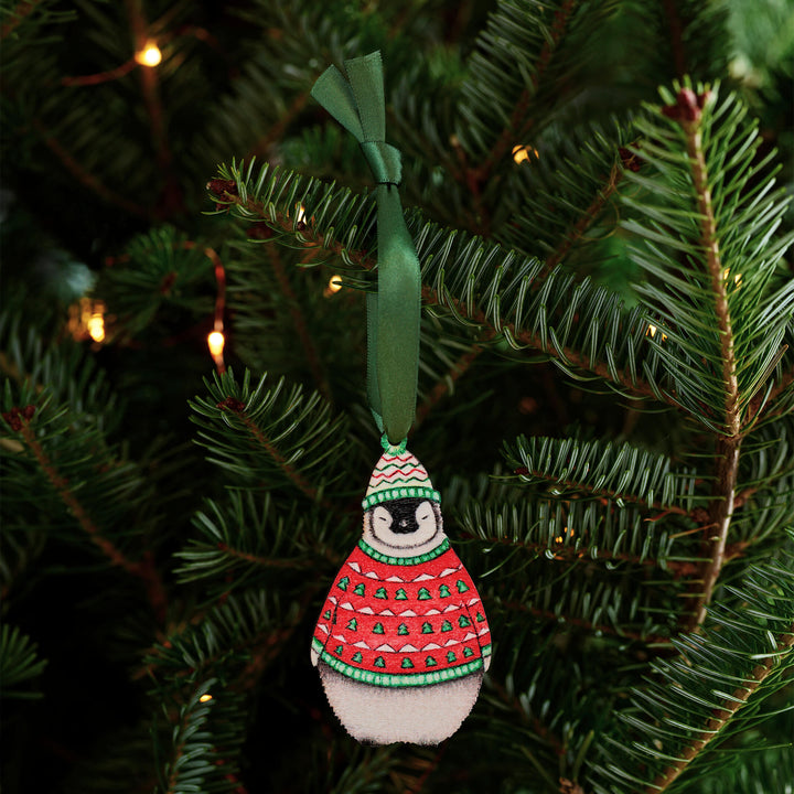 wooden penguin christmas tree decoration with green ribbon