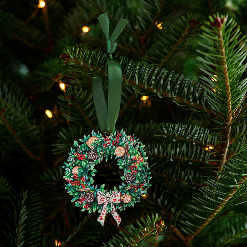 wooden wreath christmas tree decoration with green ribbon